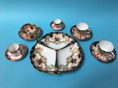 A Royal Crown Derby three division dish and five various Royal Crown Derby cups and saucers