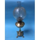 A brass oil lamp, with etched glass shade