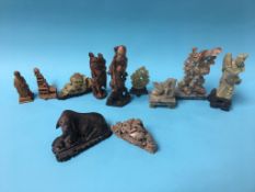 A collection of carved soapstone and carved wooden Oriental figures