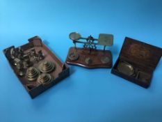 A selection of postal scales and brass weights etc.