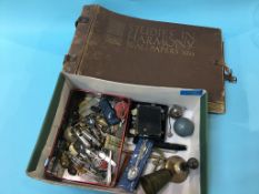 A box of assorted, to include penknives, ARP whistles and a scrap book