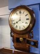 A walnut cased wall clock