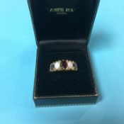 A 9ct gold opal and ruby ring, size R/S, 3.9g