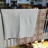 A cream Durham quilt and a modern quilt