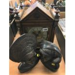 A walnut mantle clock and pair of busts