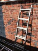 A set of extending ladders 11ft in height etc.