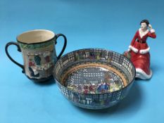 A Royal Doulton series ware bowl, D3858, a Doulton 'Pottery in the Past' jug and a figure