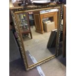 A gilt framed mirror