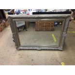 A gilt framed mirror