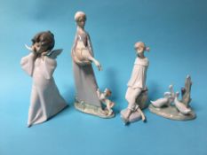 Three Lladro figures and a Nao duck group