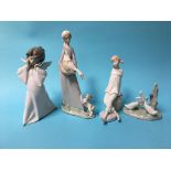 Three Lladro figures and a Nao duck group