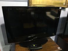 A Samsung colour TV (with remote)