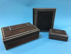 A heavily carved Indian work box, a smaller carved box and a fold out writing slope