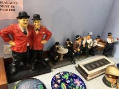 Four Stan Laurel and Oliver Hardy figures