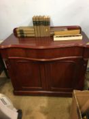 A mahogany serpentine fronted cabinet