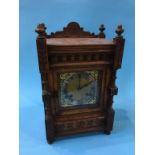 A walnut eight day mantel clock