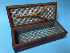 A decorative walnut glove box with stretchers, 36cm length