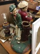 A large Laurel and Hardy golfing figure