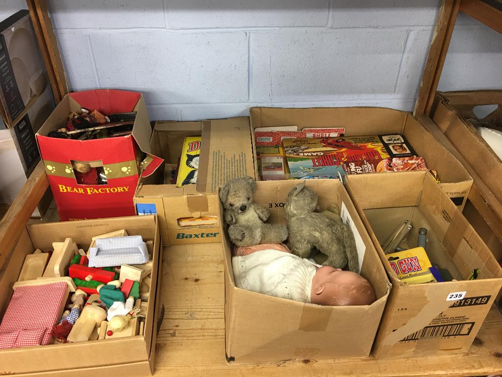 A shelf of toys and games etc.