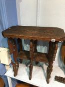 A carved Eastern two tier rectangular occasional table, 67cm wide