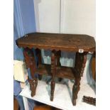 A carved Eastern two tier rectangular occasional table, 67cm wide