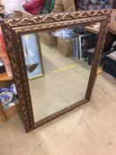 A gilt framed mirror