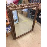 A gilt framed mirror