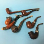 A collection of six pipes, to include Duncan and Pipe Master etc.