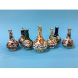 Seven various Derby vases