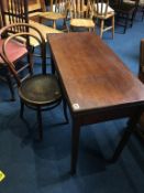 A 19th century mahogany fold over tea table and a Bentwood chair