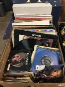 Assorted records and a record player, to include The Jam, The Beatles etc.