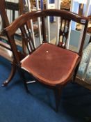 An Edwardian mahogany corner chair