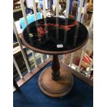 An oak circular table with decorative glass top, 46cm diameter