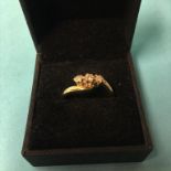 A 9ct gold three stone diamond ring, 3.9g