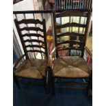 Two oak ladder back chairs