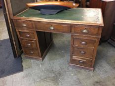 An oak pedestal desk