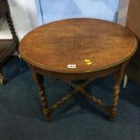 An oak circular barley twist table