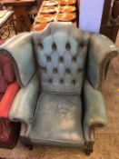A Chesterfield blue leather high back armchair