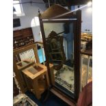 An Edwardian mahogany cheval mirror