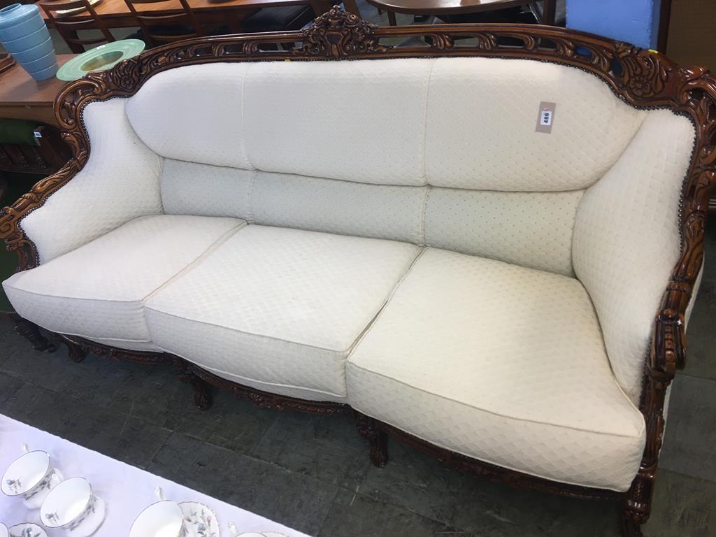 An Italian style walnut three seater settee