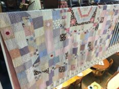 An early 20th century patchwork double quilt, 223 x 233cm approx.