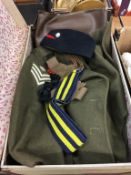 A suitcase containing an Army overcoat, hat etc.