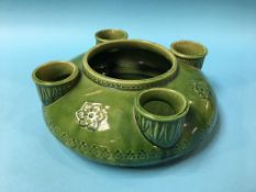 A Linthorpe style green ground flower vase, in the manner of Christopher Dresser, unmarked, 26cm