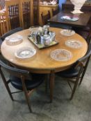 A G Plan circular teak table and four chairs