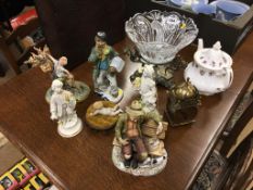 Six figurines, a teapot, a brass mantle clock and a glass bowl on stand