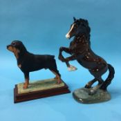 A Border Fine Arts Rottweiler and a Beswick rearing horse, number 1014