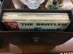 An LP carry case and LPs, to include The Beatles etc.