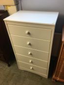 A modern white chest of drawers