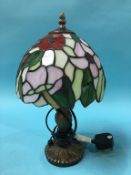 A small Tiffany style table lamp