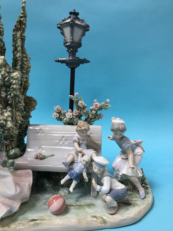 A large Lladro group of Children playing by a bench, with two Ladies and a Dog at their side - Image 3 of 4